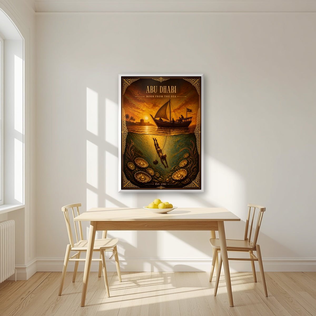 Born from the Sea in a white frame, above a dining table in a bright kitchen