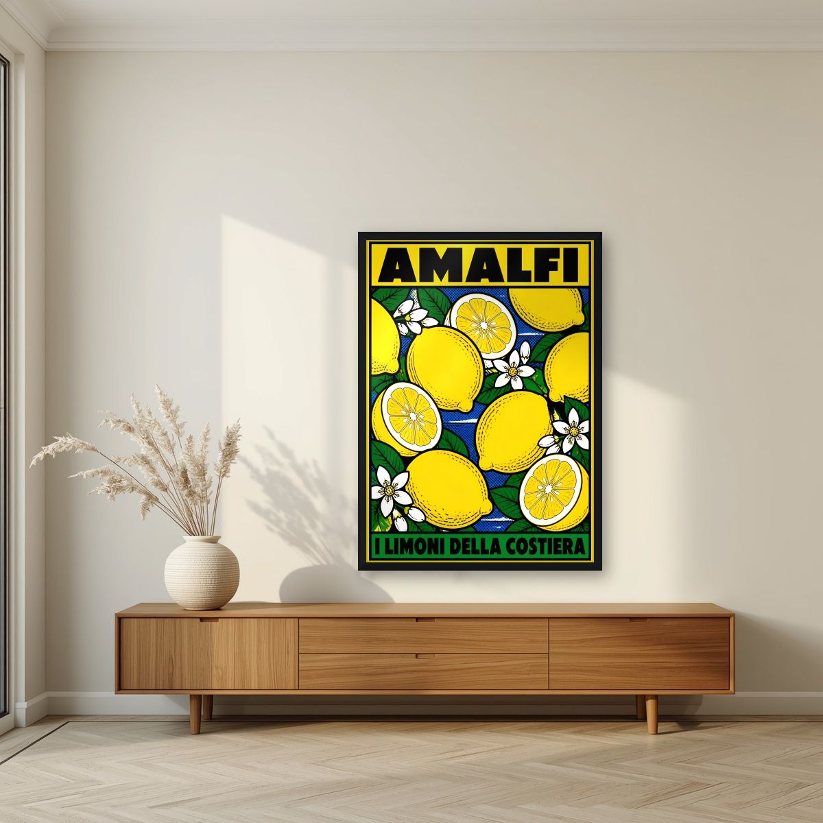 I Limoni Della Costiera — Amalfi Coast art print, in a black frame, styled in a living room