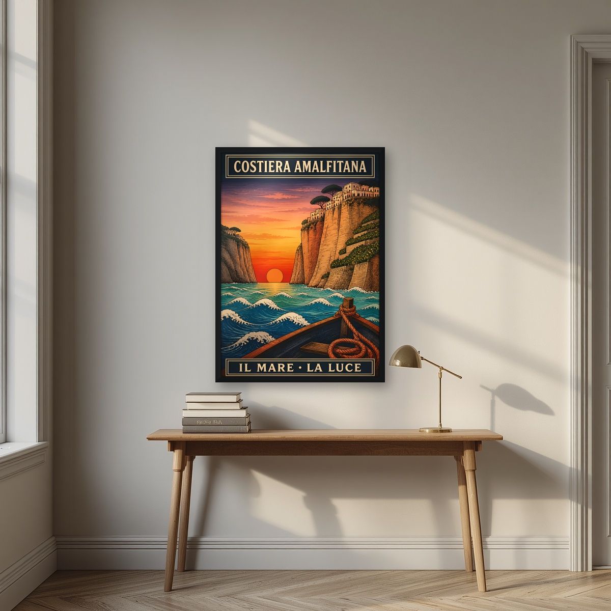 Il Mare La Luce — Amalfi Coast art print, in a black frame, styled in a desk