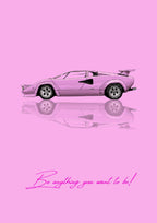 Be Anything You Want To Be – Rosa art print: a pink Lamborghini Countach drawn flat in side profile, wedge nosed and low with its rear wing squared off, doubled by a gentle mirrored reflection, on a soft pink ground, with the handwritten line Be anything you want to be! underneath