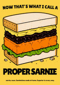 Now That's What I Call a Proper Sarnie – Piccalilli art print: the same heavily outlined stacked sandwich artwork with black slogan lettering, set on a warm mustard-yellow background