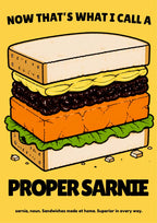 Now That's What I Call a Proper Sarnie – Piccalilli art print: the same heavily outlined stacked sandwich artwork with black slogan lettering, set on a warm mustard-yellow background
