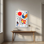 Ocell Blau — Barcelona art print, in a white frame, styled in a desk