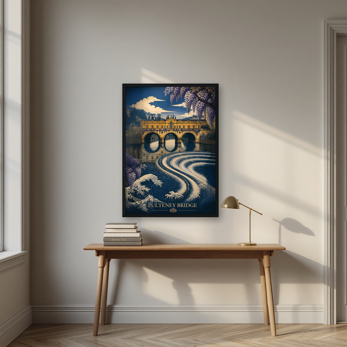 Pulteney Bridge in a black frame, above an oak writing desk