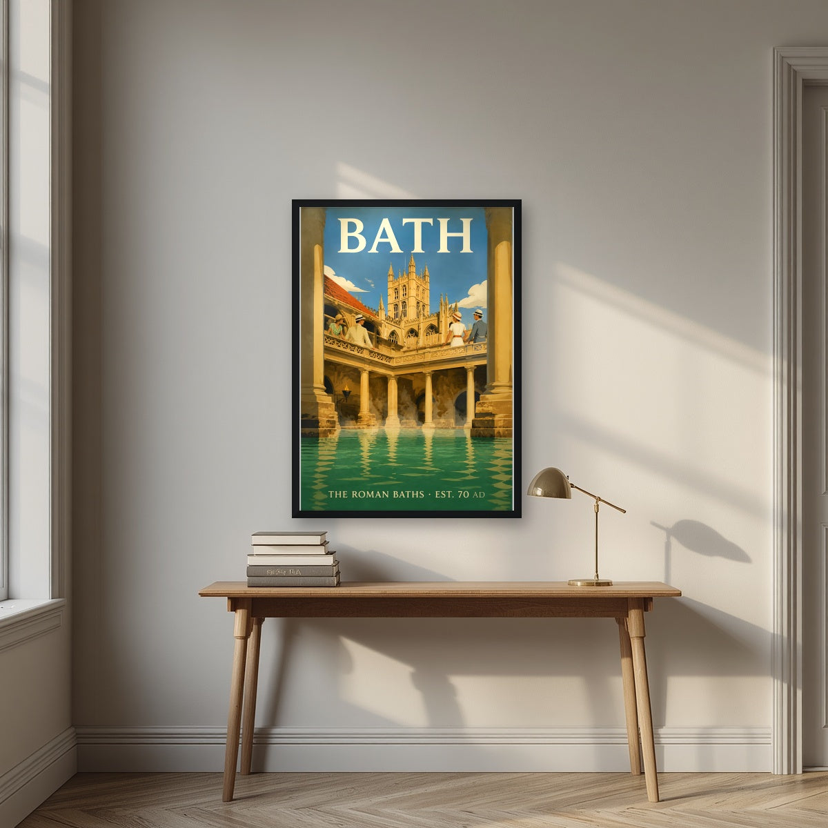 The Roman Baths in a black frame, above an oak writing desk