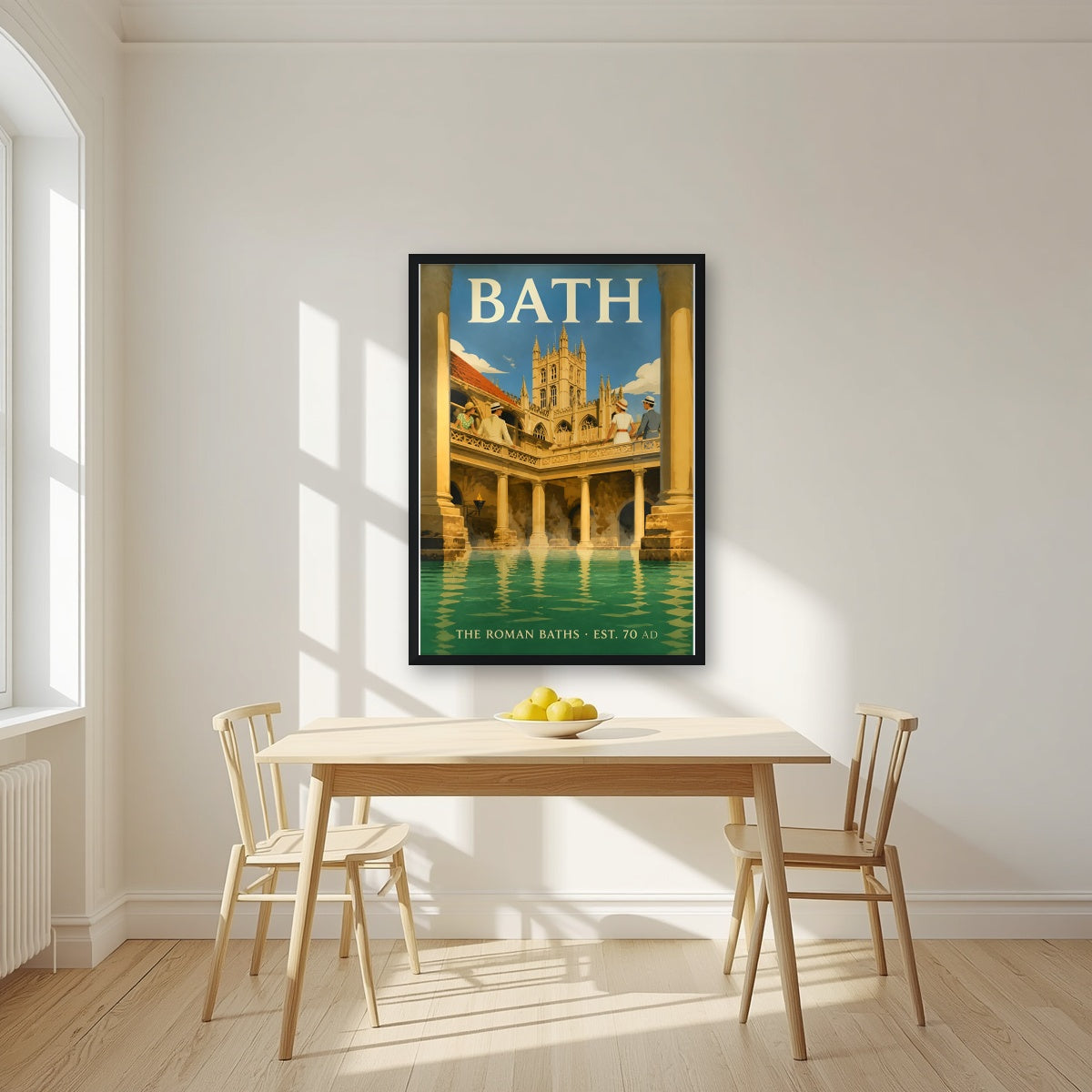 The Roman Baths in a black frame, above a dining table in a bright kitchen