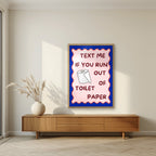 Text Me If You Run Out of Toilet Paper – Cobalt Blue art print, in an oak frame, styled in a living room