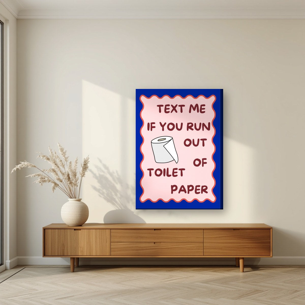 Text Me If You Run Out of Toilet Paper – Cobalt Blue art print, on slim canvas, styled in a living room
