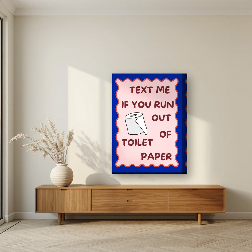 Text Me If You Run Out of Toilet Paper – Cobalt Blue art print, on thick canvas, styled in a living room