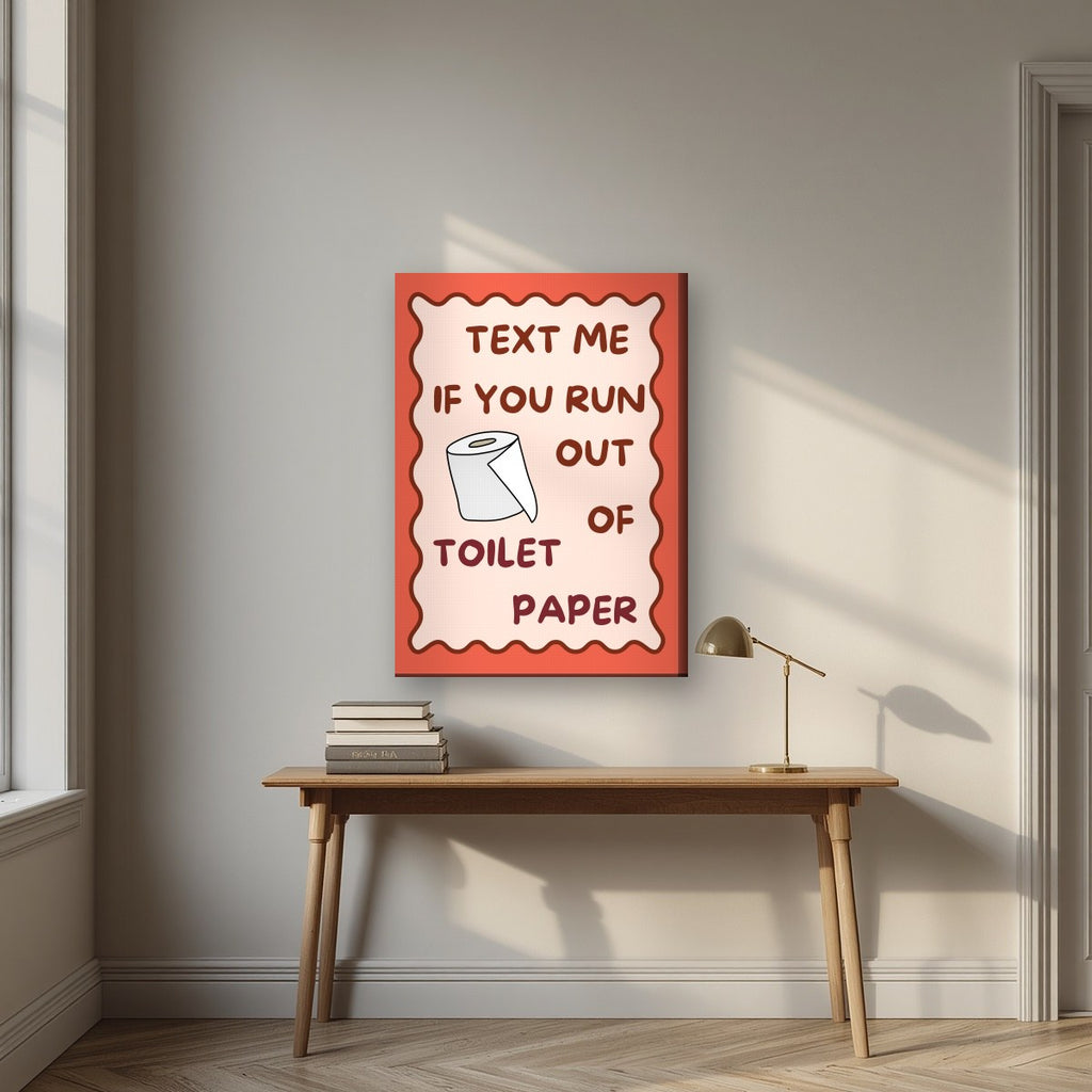 Text Me If You Run Out of Toilet Paper – Coral Clay art print, on slim canvas, styled in a desk