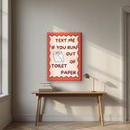 Text Me If You Run Out of Toilet Paper – Coral Clay art print, on slim canvas, styled in a desk