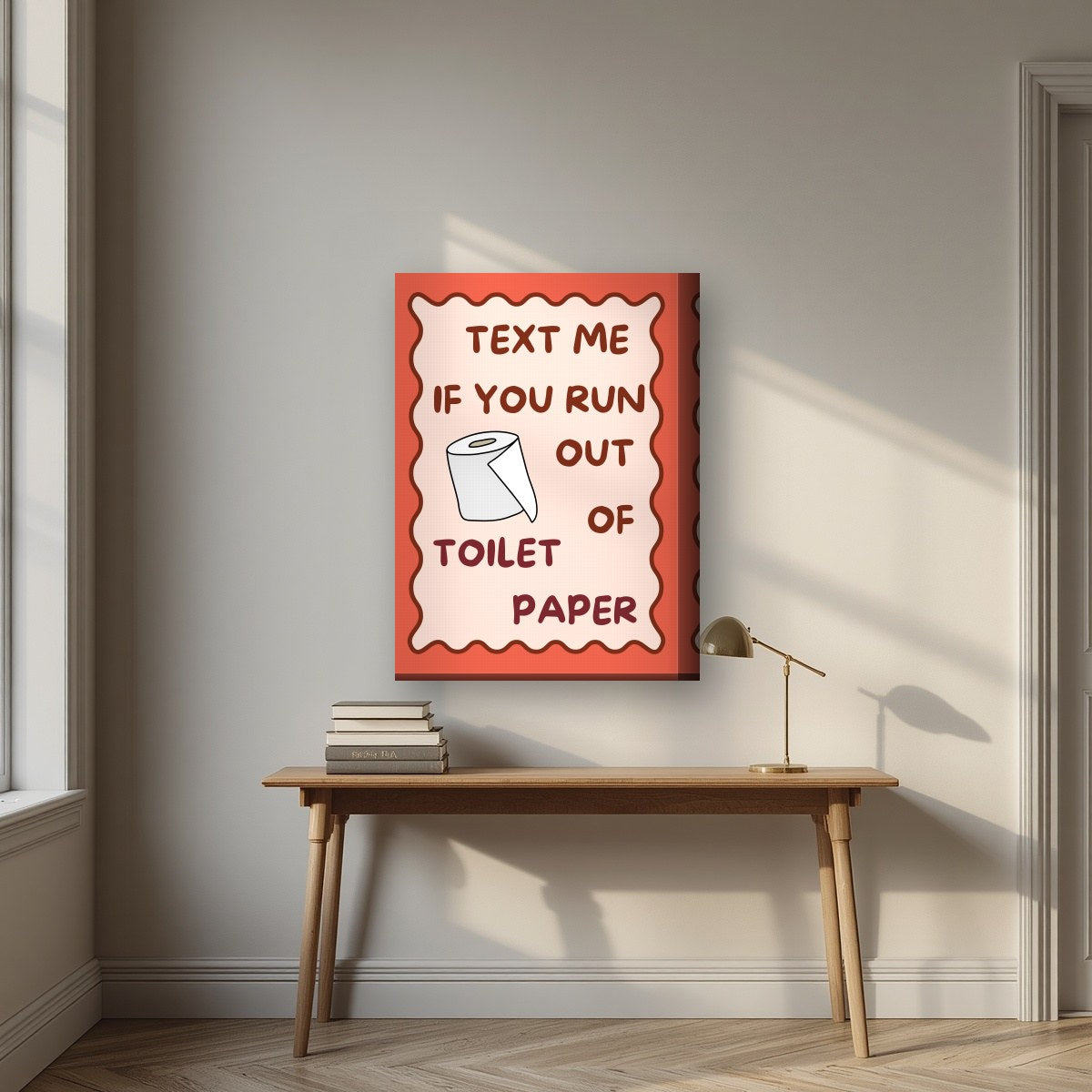 Text Me If You Run Out of Toilet Paper – Coral Clay art print, on thick canvas, styled in a desk