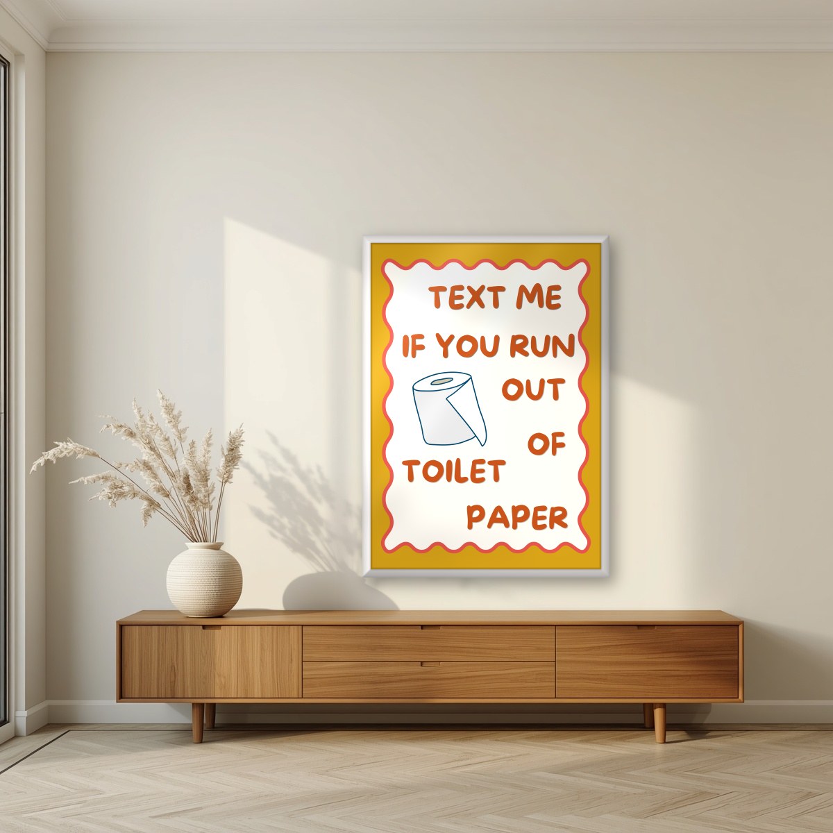 Text Me If You Run Out of Toilet Paper – Mustard Gold art print, in a white frame, styled in a living room