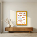 Text Me If You Run Out of Toilet Paper – Mustard Gold art print, on slim canvas, styled in a living room
