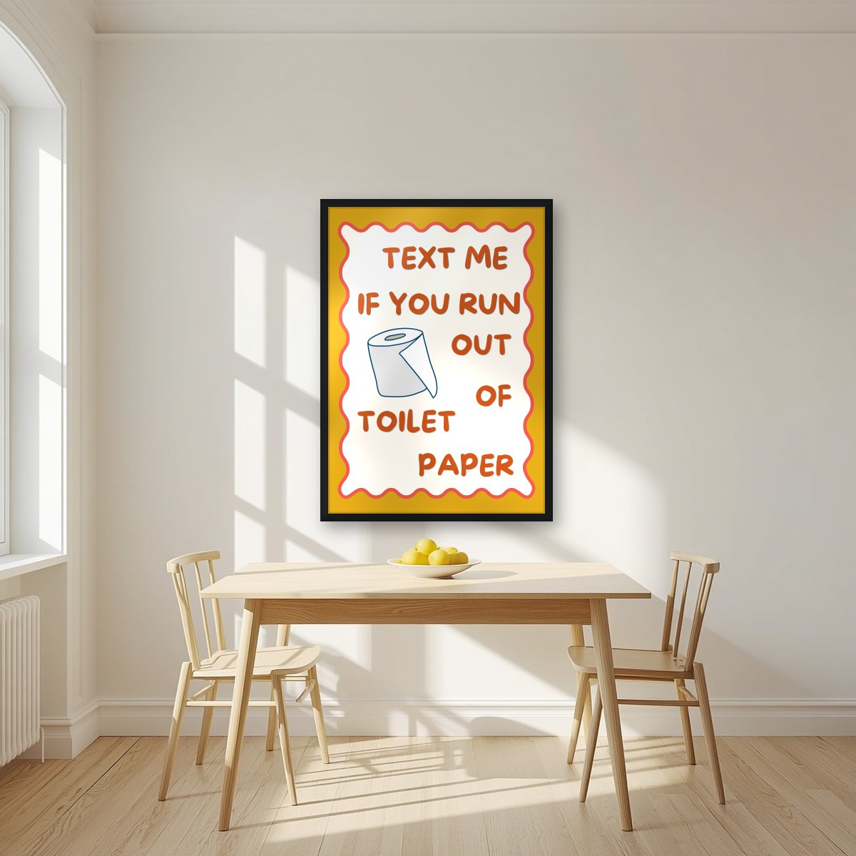 Text Me If You Run Out of Toilet Paper – Mustard Gold art print, in a black frame, styled in a kitchen