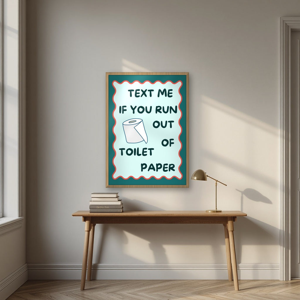 Text Me If You Run Out of Toilet Paper – Seafoam Teal art print, in an oak frame, styled in a desk