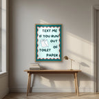 Text Me If You Run Out of Toilet Paper – Seafoam Teal art print, in an oak frame, styled in a desk