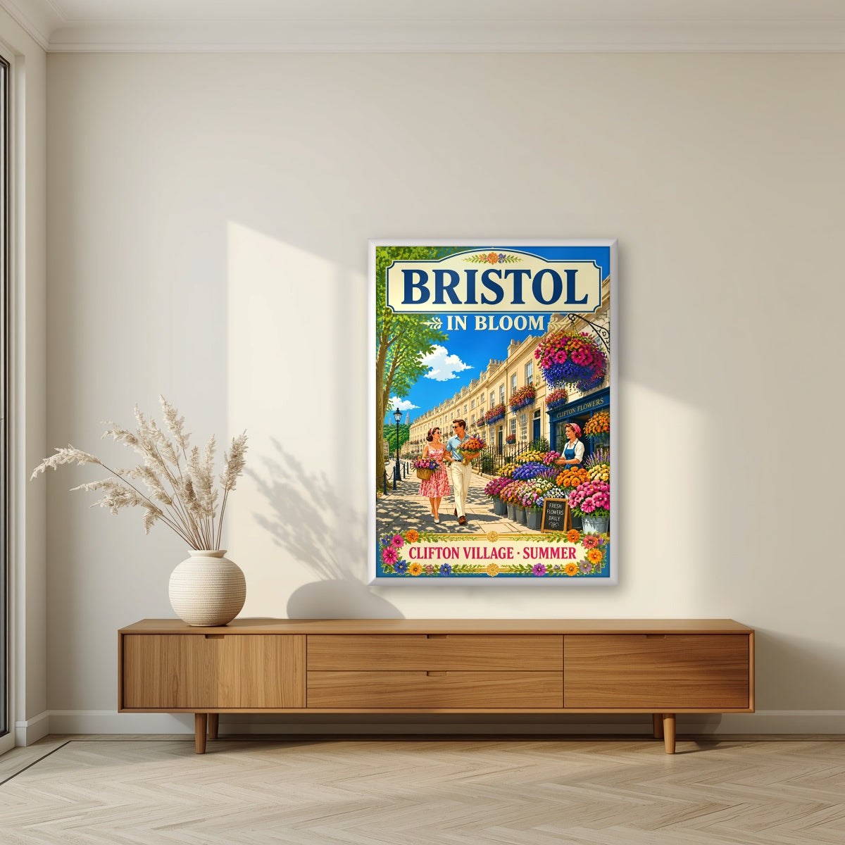 Clifton Village in a white frame, above a walnut sideboard in a living room