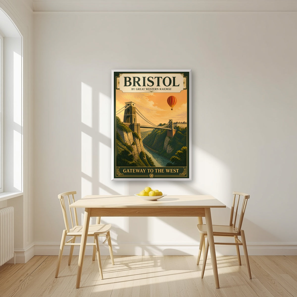 Gateway to the West in a white frame, above a dining table in a bright kitchen