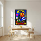 Up, Up and Away in a black frame, above a dining table in a bright kitchen