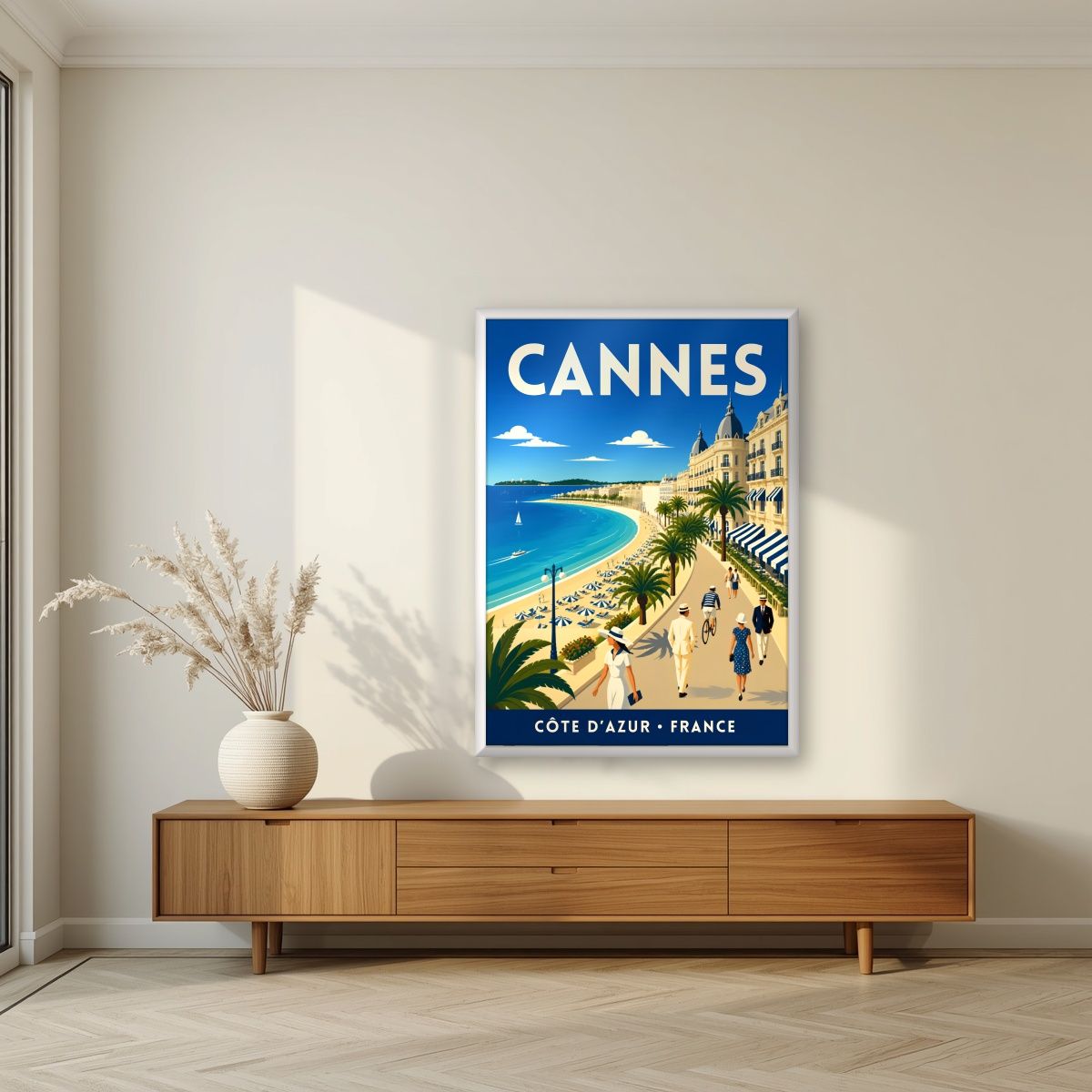 Les Élégants — Cannes art print, in a white frame, styled in a living room