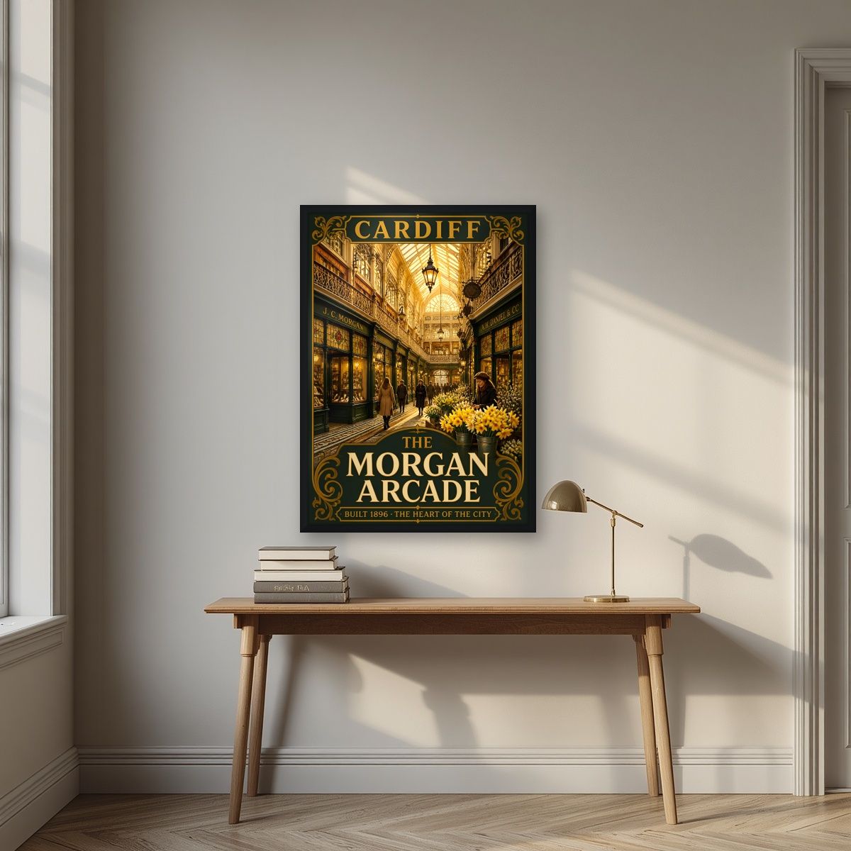 The Morgan Arcade — Cardiff art print, in a black frame, styled in a desk