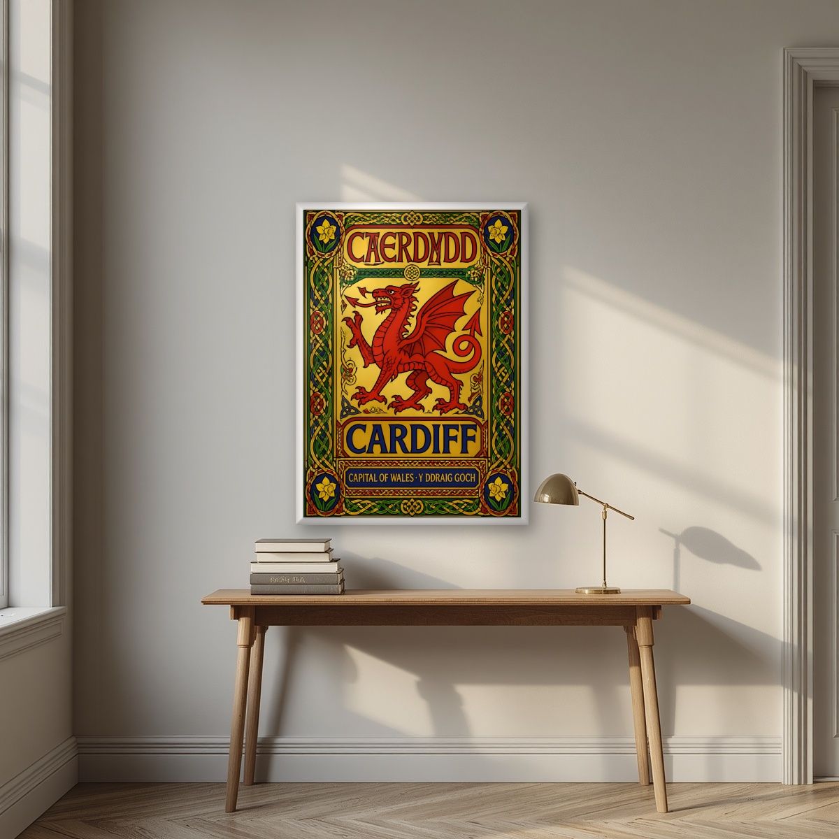 The Red Dragon — Cardiff art print, in a white frame, styled in a desk