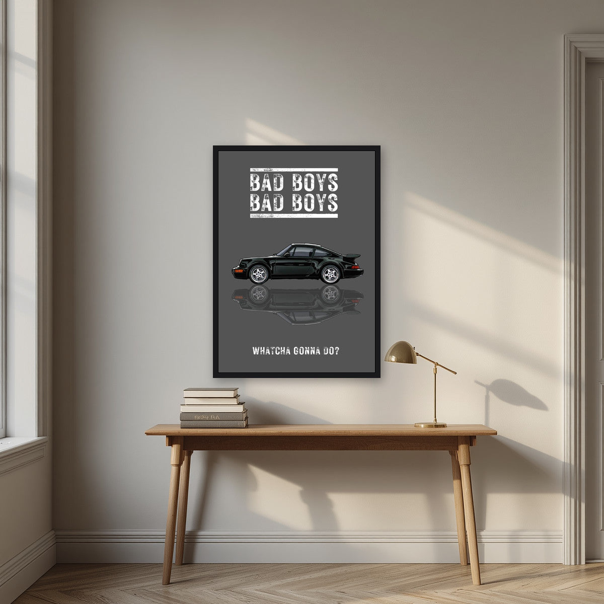 Bad Boys – Slate Grey art print, in a black frame, styled in a desk
