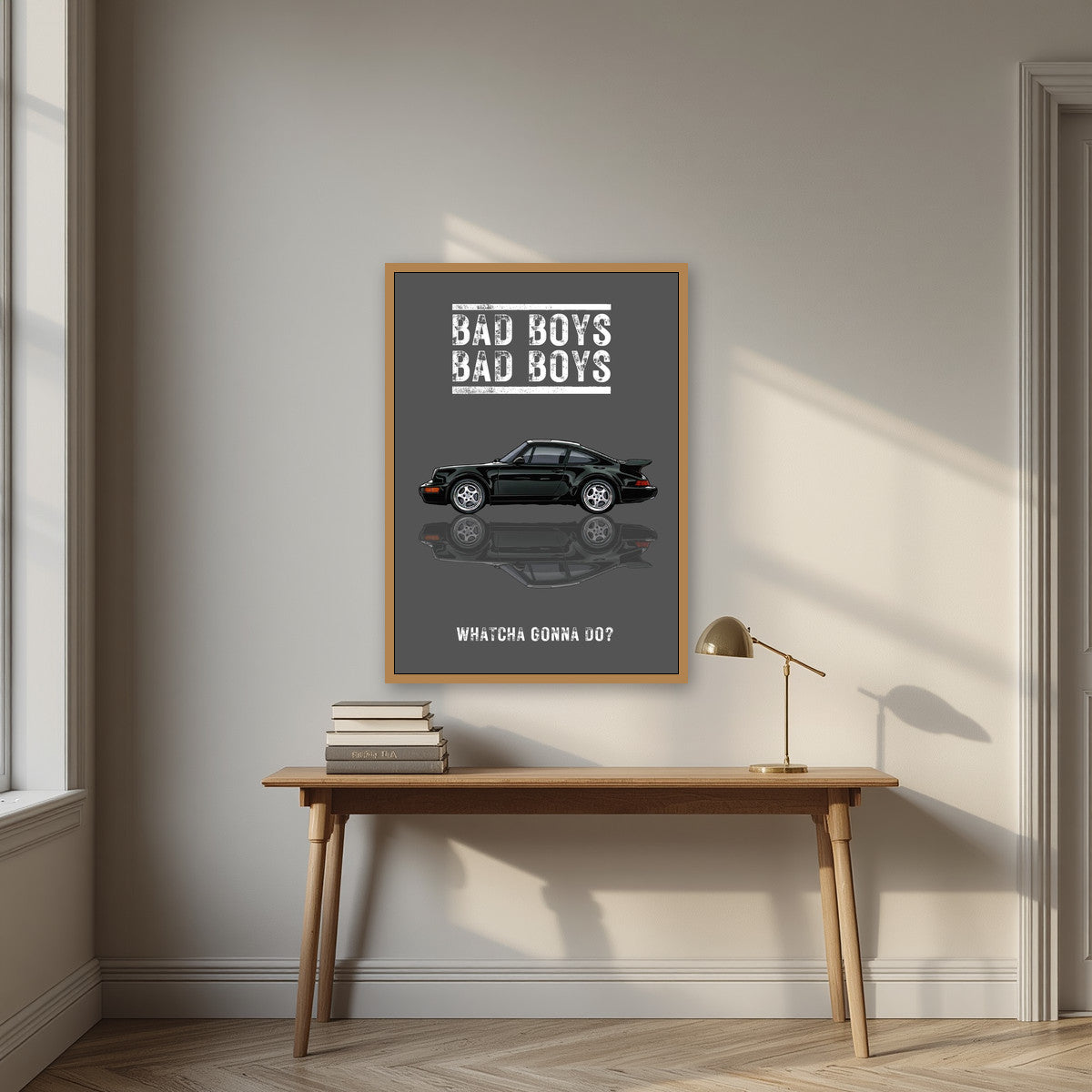 Bad Boys – Slate Grey art print, in an oak frame, styled in a desk