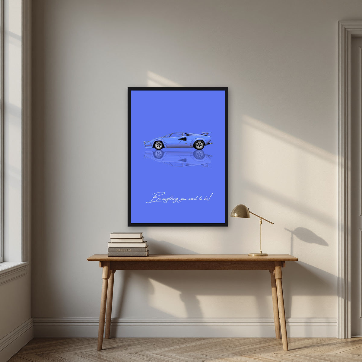 Be Anything You Want To Be – Blu art print, in a black frame, styled in a desk