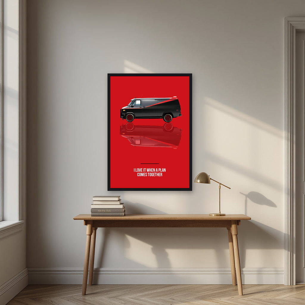 I Love It When a Plan Comes Together – Alarm Red art print, in a black frame, styled in a desk