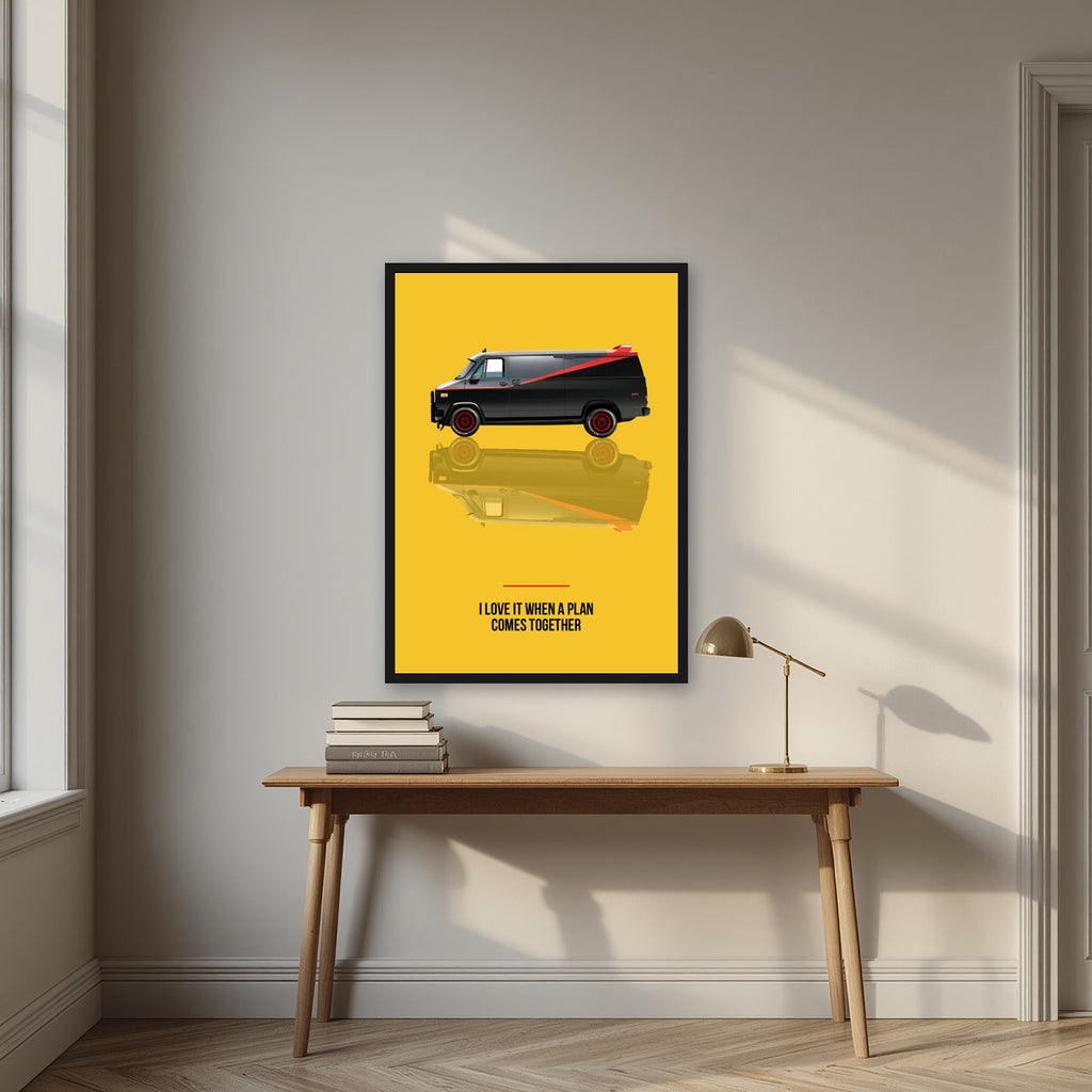 I Love It When a Plan Comes Together – Amber Yellow art print, in a black frame, styled in a desk