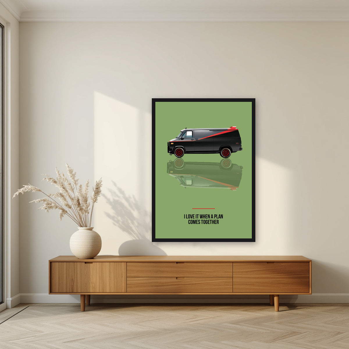 I Love It When a Plan Comes Together – Fatigue Green art print, in a black frame, styled in a living room