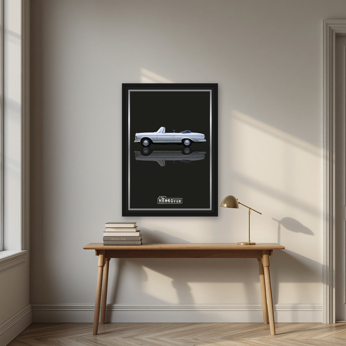 The Hangover – Tuxedo Black art print, in a black frame, styled in a desk