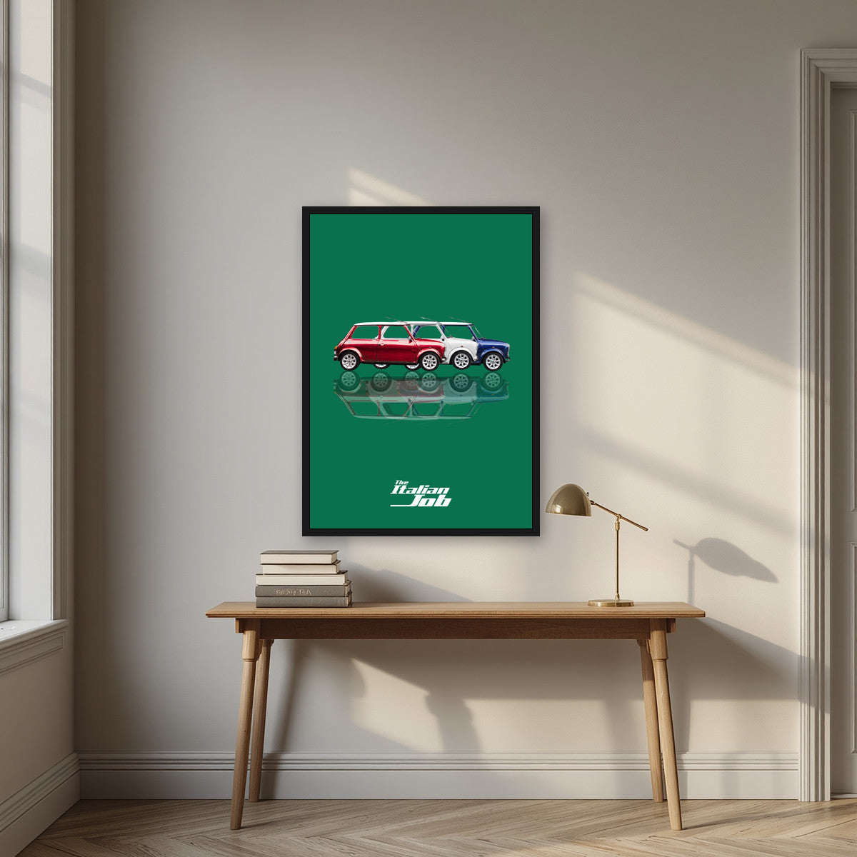 The Italian Job – Alpine Green art print, in a black frame, styled in a desk