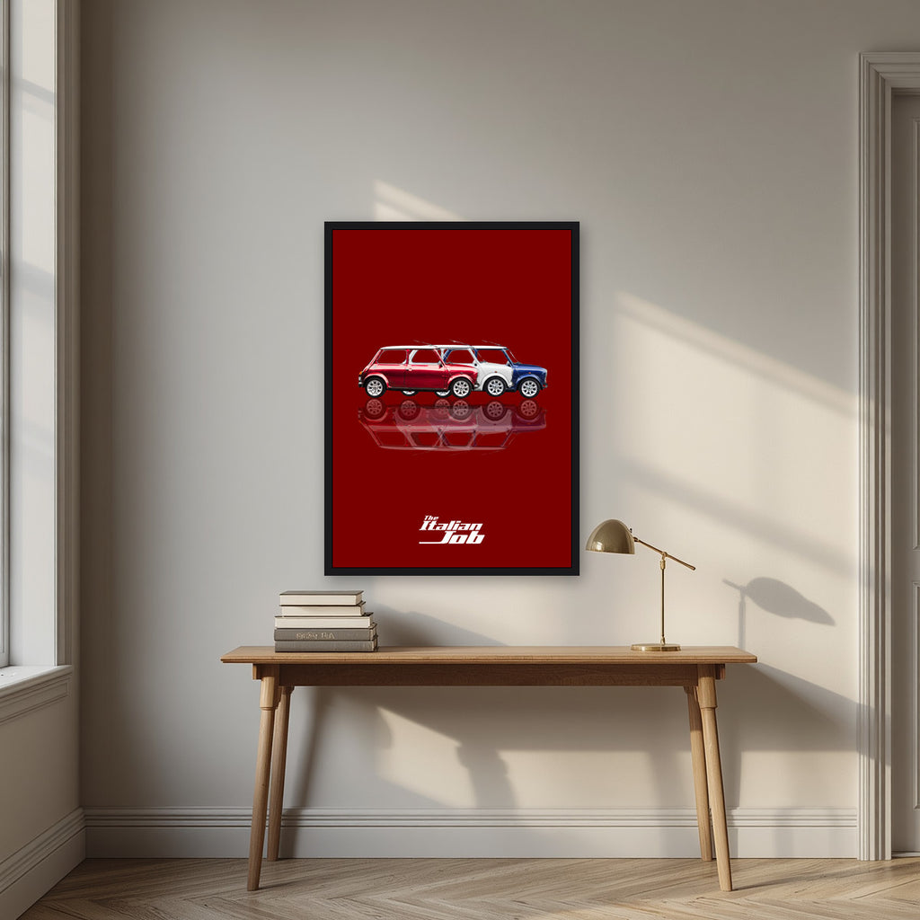 The Italian Job – Crimson Red art print, in a black frame, styled in a desk