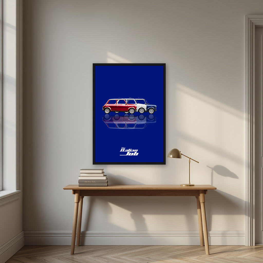 The Italian Job – Turin Blue art print, in a black frame, styled in a desk