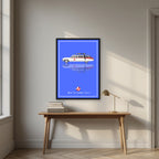Who Ya Gonna Call? – Proton Blue art print, in a black frame, styled in a desk