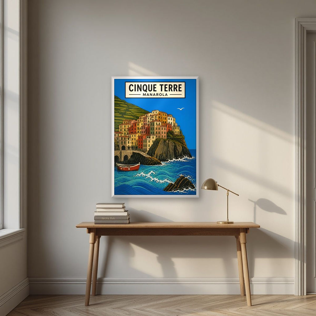 Manarola Blu — Cinque Terre art print, in a white frame, styled in a desk