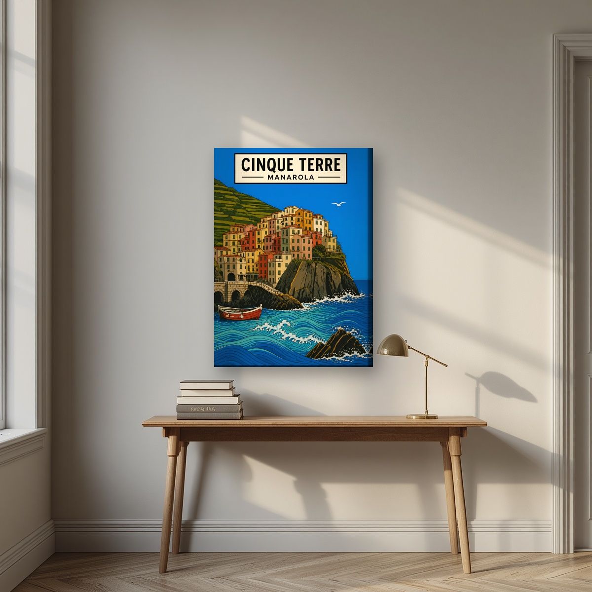 Manarola Blu — Cinque Terre art print, on slim canvas, styled in a desk