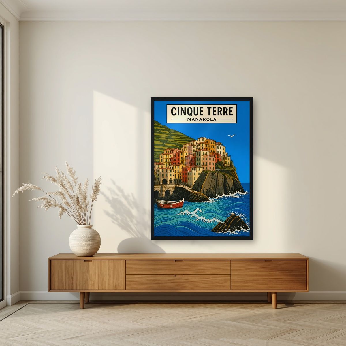 Manarola Blu — Cinque Terre art print, in a black frame, styled in a living room