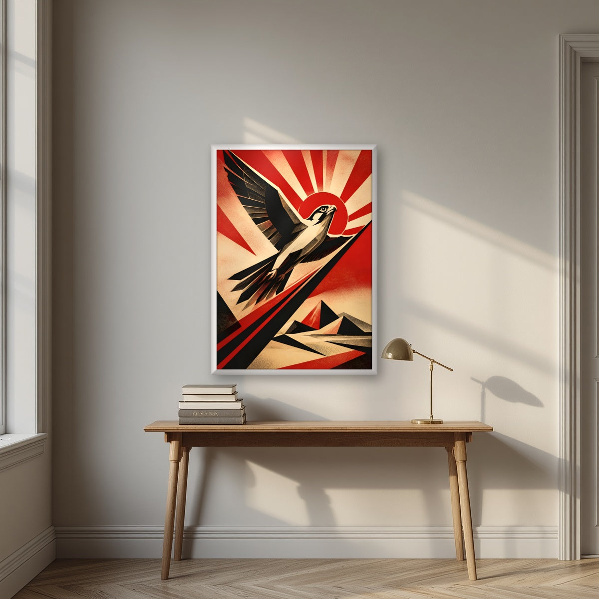 Falcon Rising in a white frame, above an oak writing desk