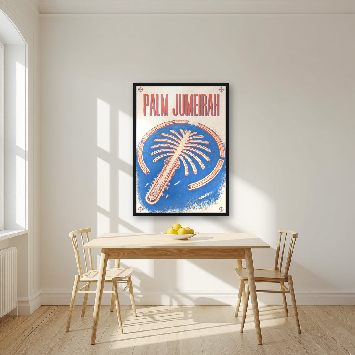 Palm Jumeirah Blueprint in a black frame, above a dining table in a bright kitchen