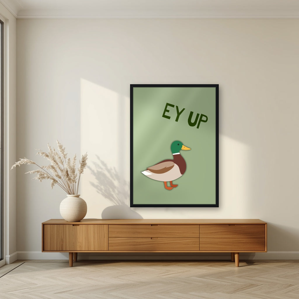 Ey Up Duck – Allotment Sage art print in a black frame, styled in a living room