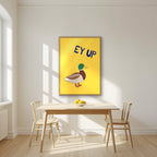Ey Up Duck – Custard Gold art print in an oak frame, styled in a kitchen