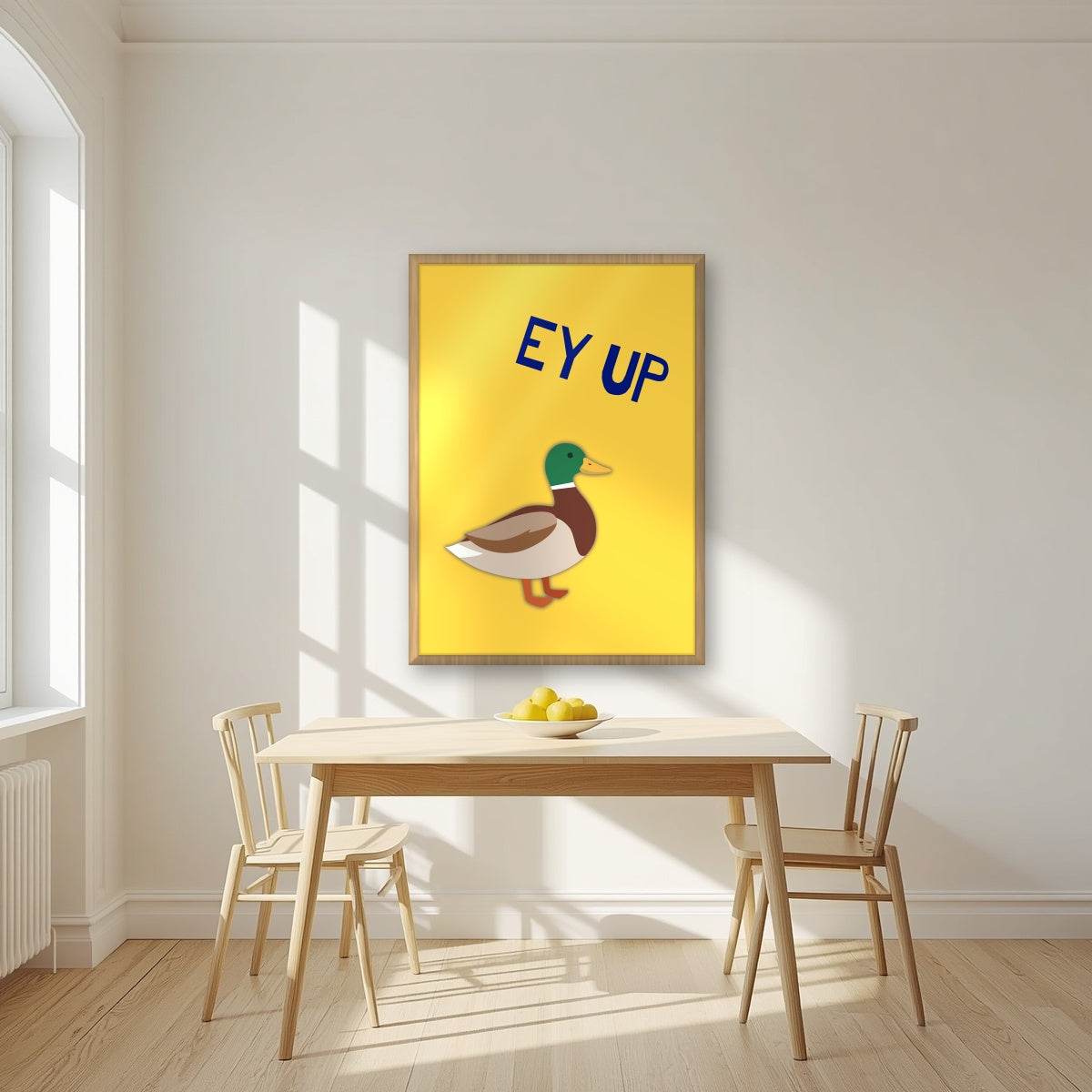 Ey Up Duck – Custard Gold art print in an oak frame, styled in a kitchen