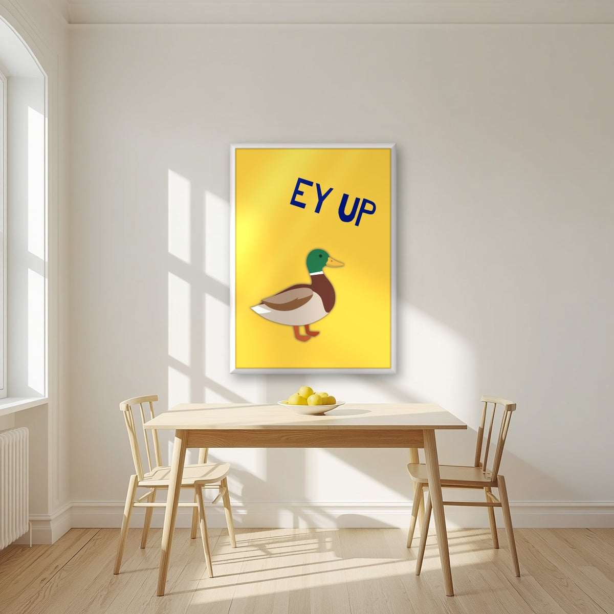 Ey Up Duck – Custard Gold art print in a white frame, styled in a kitchen