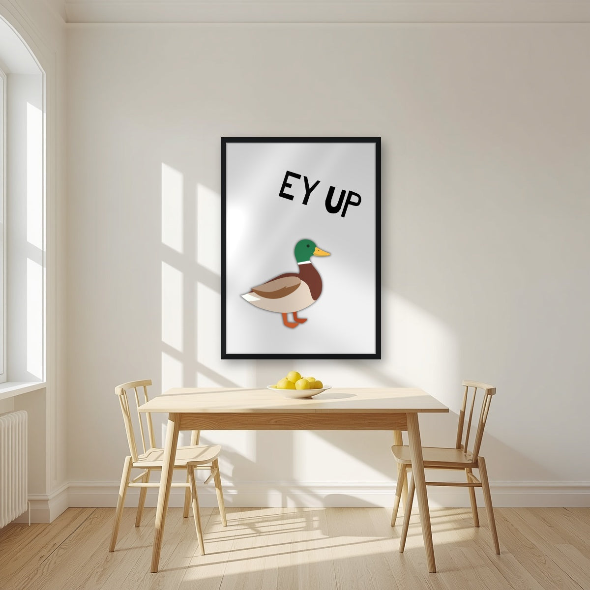 Ey Up Duck – Drizzle Grey art print in a black frame, styled in a kitchen