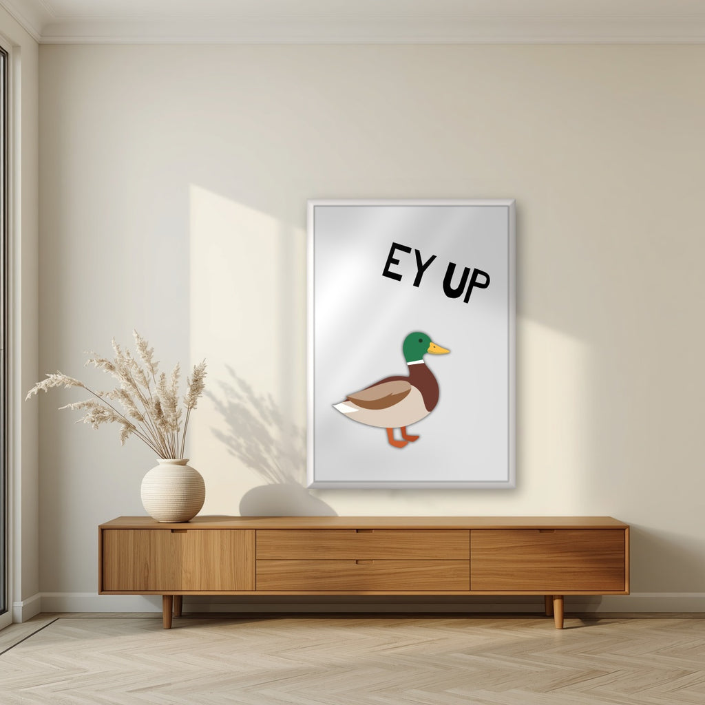Ey Up Duck – Drizzle Grey art print in a white frame, styled in a living room