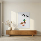 Ey Up Duck – Drizzle Grey art print, unframed poster, styled in a living room